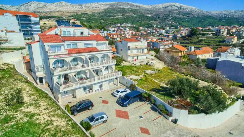 Aerial view of Stipe Residence in Podstrana with mountains behind